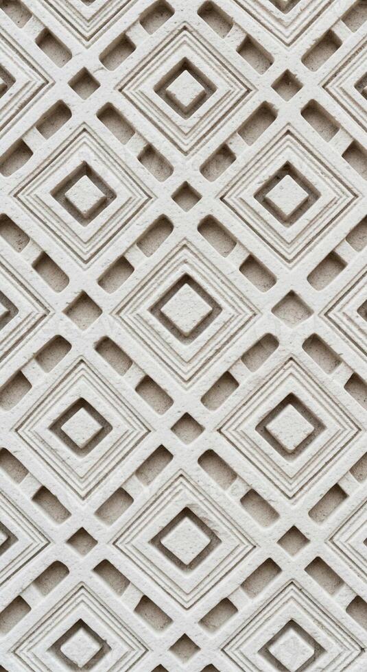 Intricate geometric diamond pattern with a subtle textured surface and shadow play photo