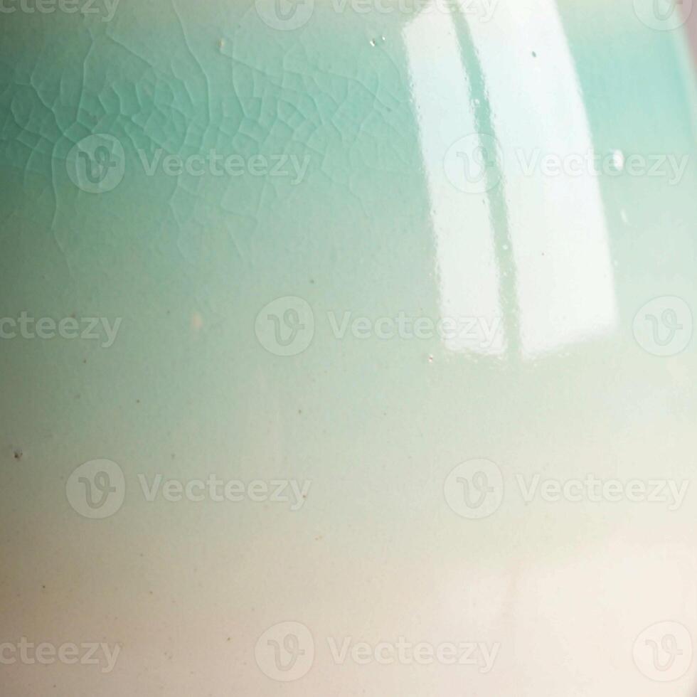 Abstract textured background with soft pastel green and white gradients and subtle light reflections creating a serene and airy atmosphere photo