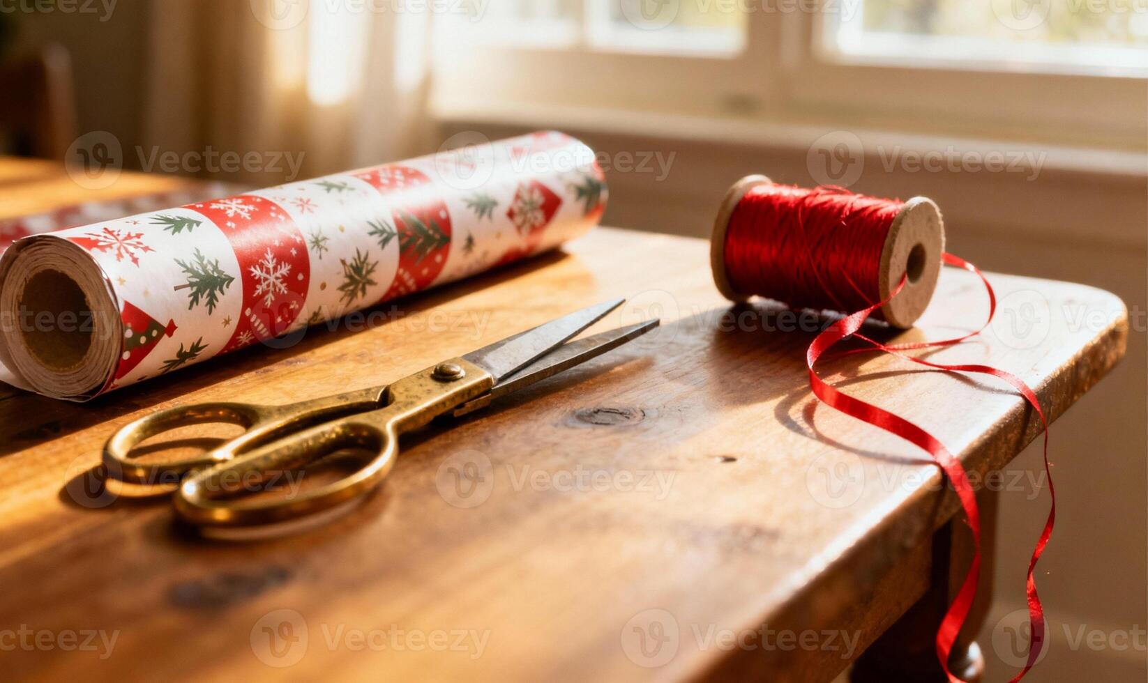 Scissors and Wrapping Paper Roll on Table with Red Twine photo