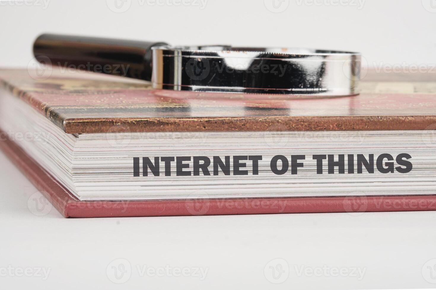 The concept of technology and development. Phrase, words, text INTERNET OF THINGS on the end of the book, a close-up front view photo