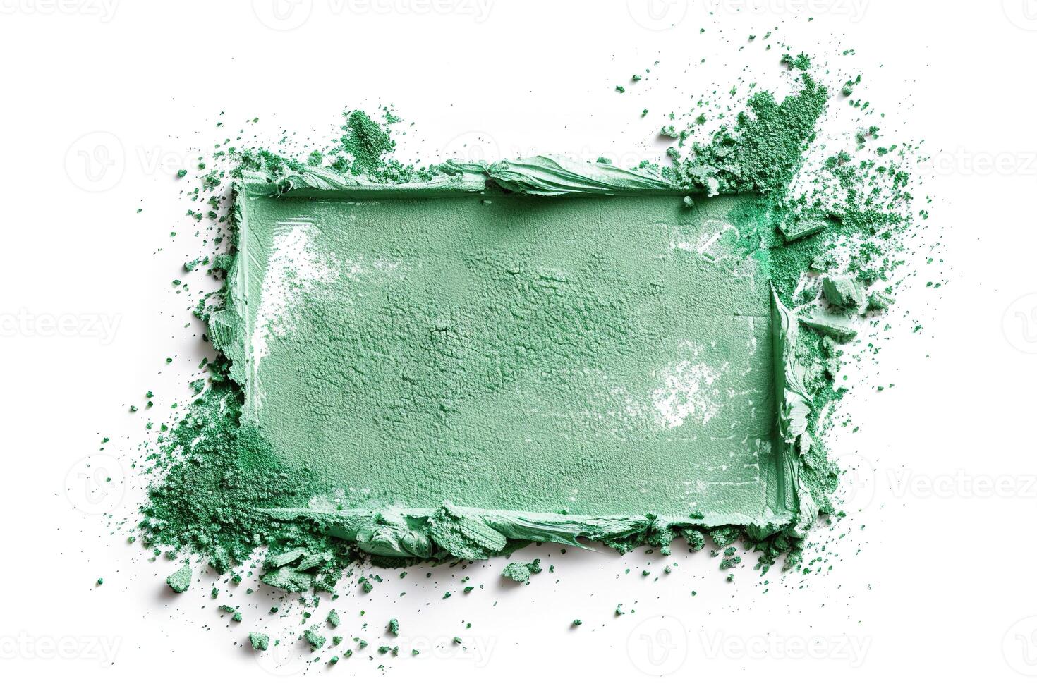 Bright green powder is arranged in a rectangular border, surrounded by a subtle sparkle. The smooth texture contrasts with the scattered particles around it, creating an artistic feel photo