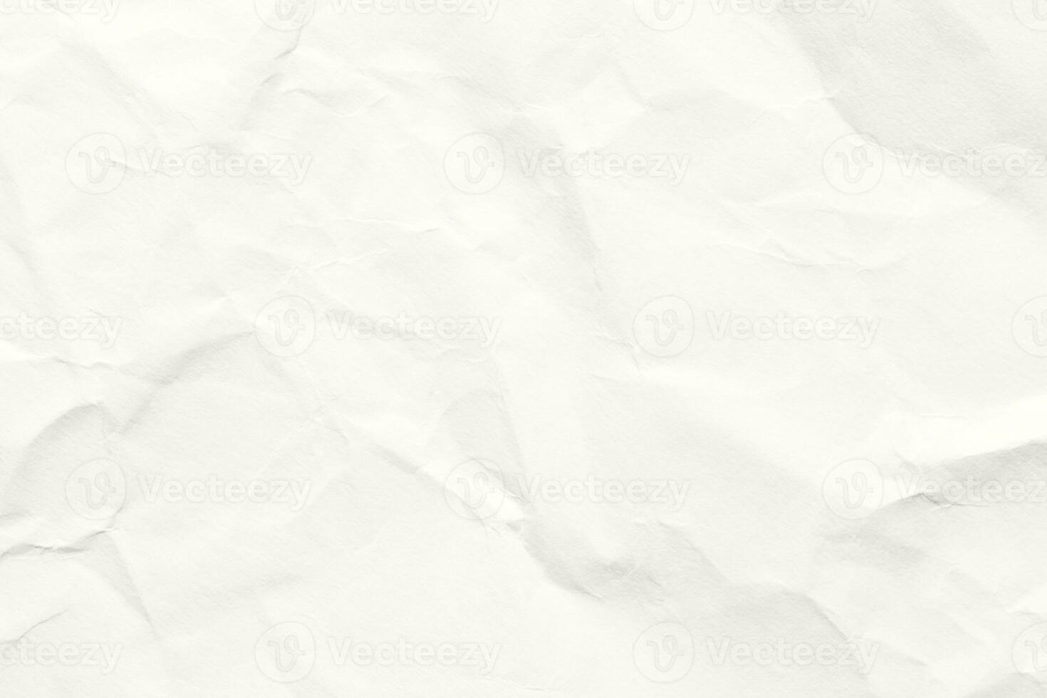 Light crumpled paper texture in soft neutral tones creating a minimal background with subtle folds creases and natural surface details suitable for design craft and artistic themes. Craft photo