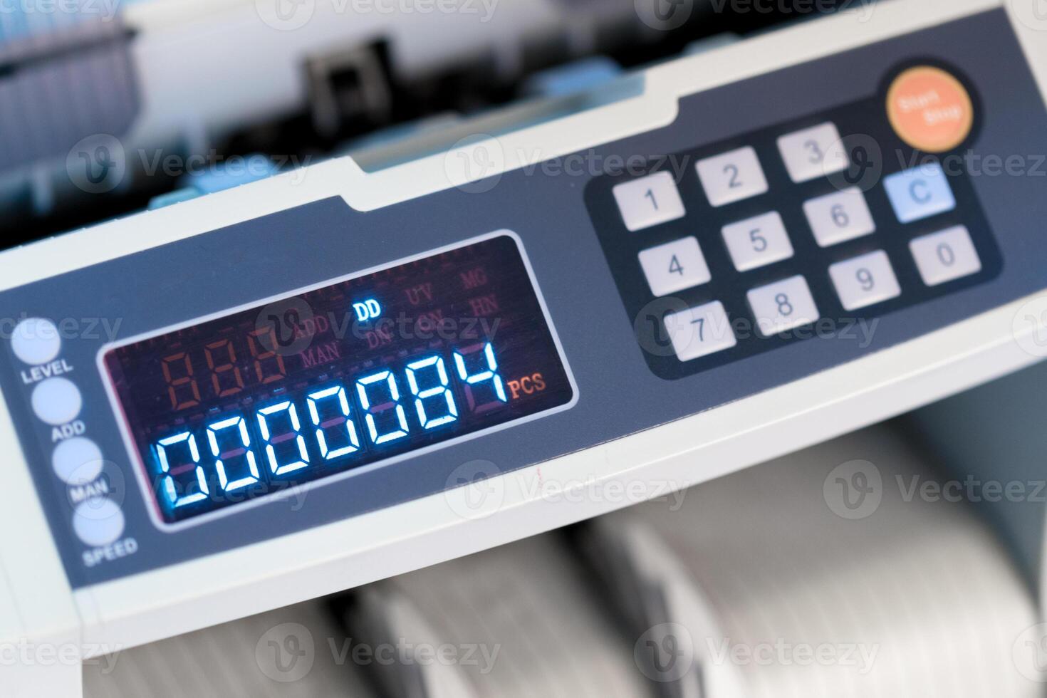 Counting machine displays count of paper sheets in an office setting photo