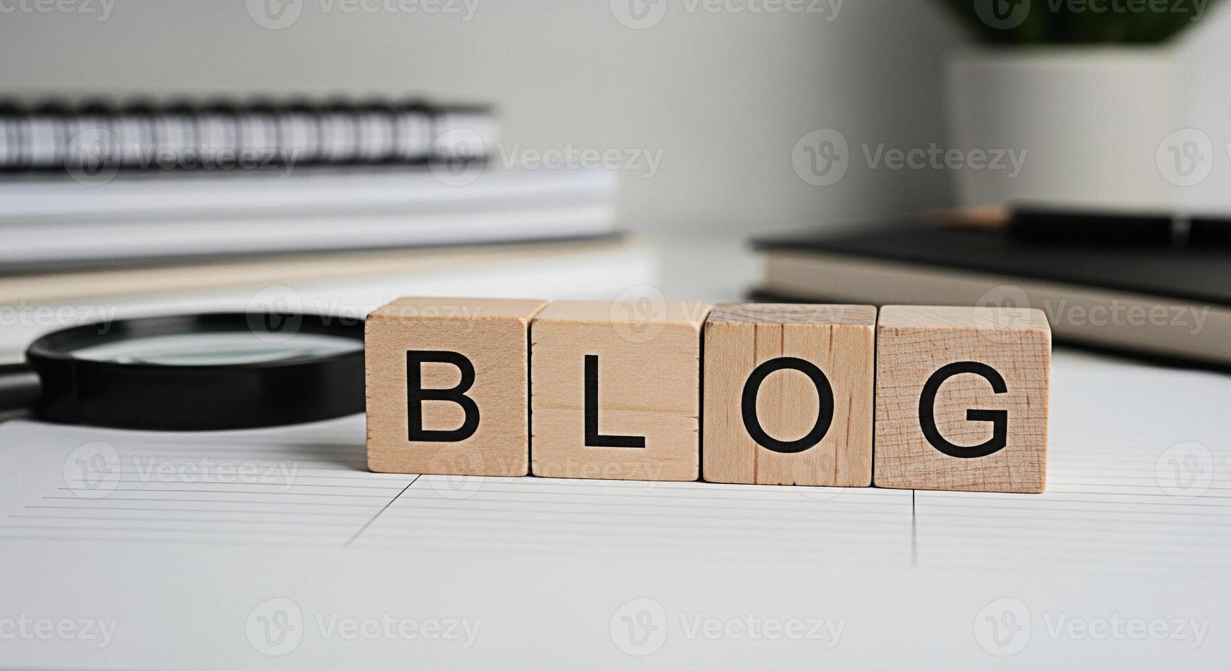 Wooden blocks spelling BLOG rest on lined paper symbolizing content creation and online presence in a bright minimalist workspace conveying a sense of organization and focus for digital marketing stra photo
