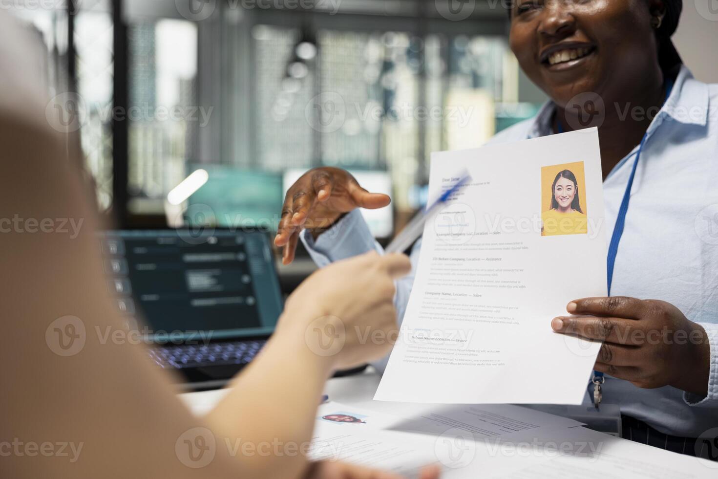 Human resources specialists applying artificial intelligence systems and smart automation to filter resumes, evaluate applicants and streamline the onboarding process after interviews. photo