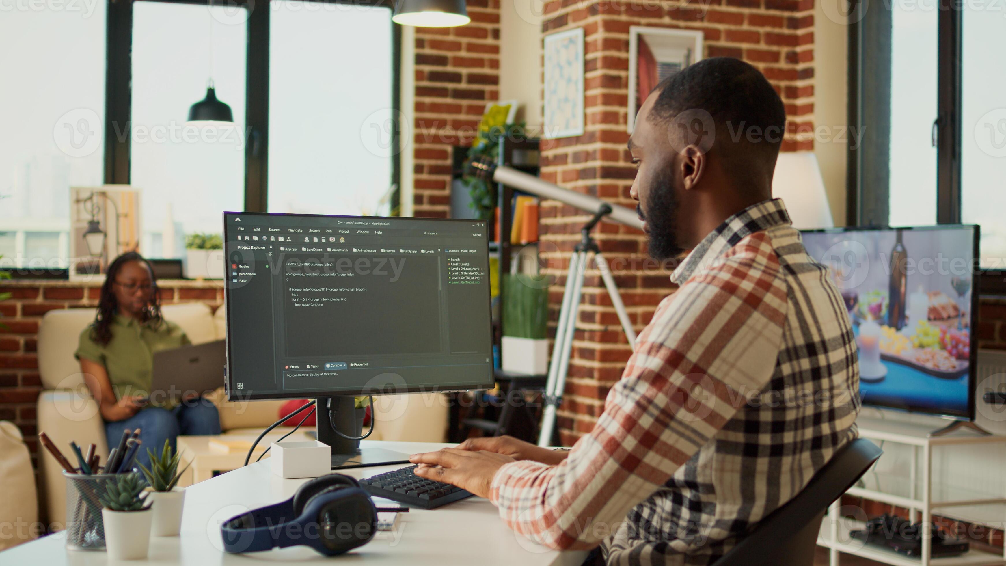 Male app developer using html script code on computer, programming new ...