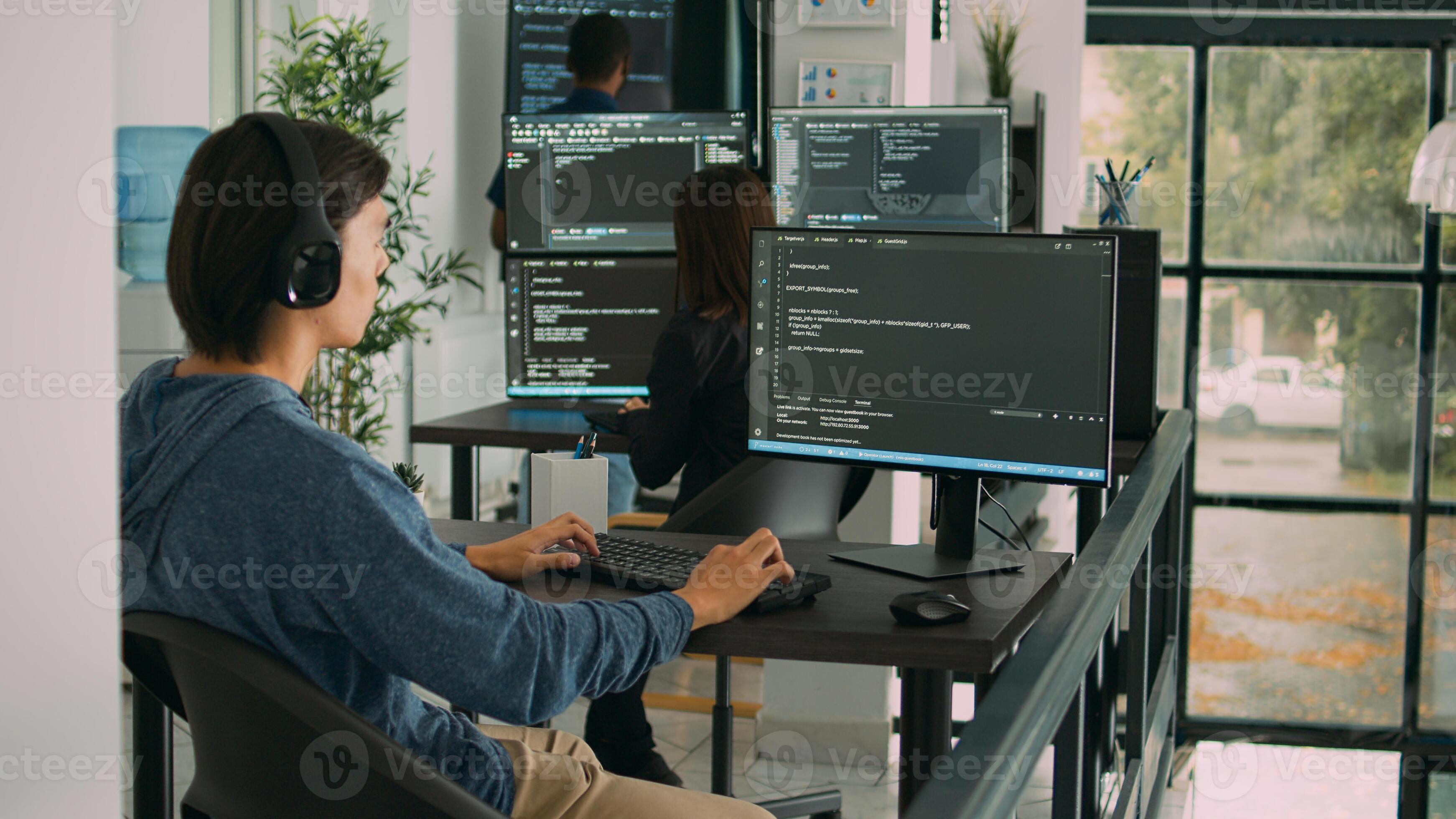 Junior developer programming code on terminal window, typing server ...