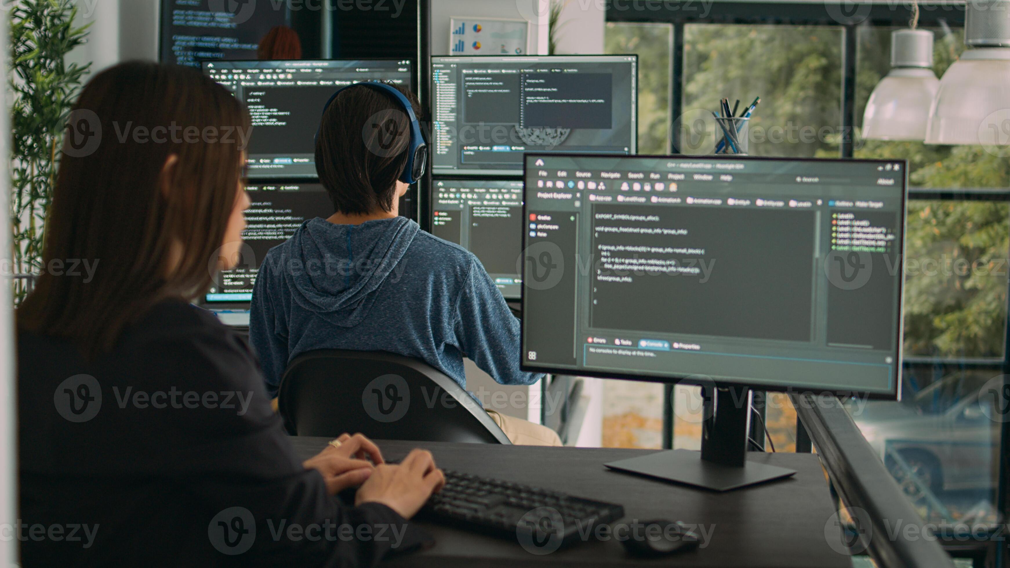 Woman programer typing source code on computer keyboard to develop new ...