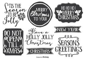 Lindo conjunto de etiquetas de estilo dibujado a mano desordenado de Navidad vector
