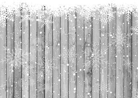 Copos de nieve de Navidad sobre fondo de madera vector