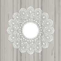 Lace style mandala on a wooden background vector