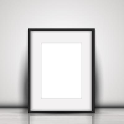 Blank picture leaning against a white wall