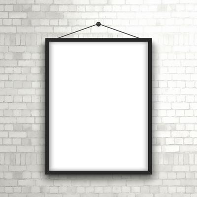 Blank picture frame on brick wall 