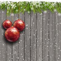 Christmas baubles on a wooden background vector