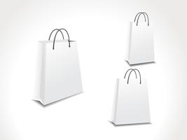conjunto de ilustración de tres bolsas de compras de papel. vector