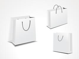 conjunto de ilustración de tres bolsas de compras de papel. vector