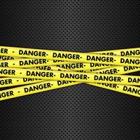 Danger tape on metallic background vector