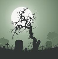 Árbol muerto fantasmagórico de Halloween en el cementerio