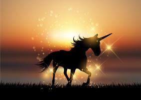 Silhouette of a unicorn in a sunset landscape vector