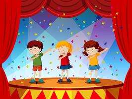 Group of children perform on stage vector