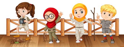 Four kids in safari outfit on the bridge vector