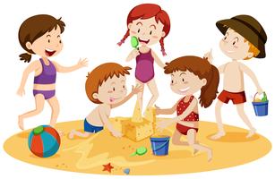 Niños jugando en la playa vector