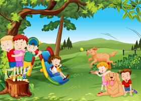 Group of children and dogs playing in the park vector