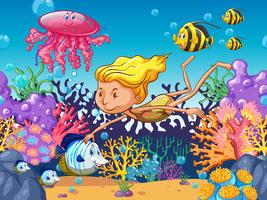 Chica nadando con animales marinos bajo el agua vector