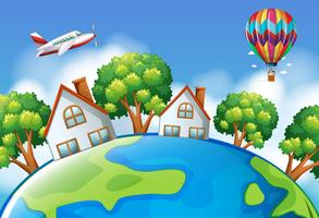 Airplane and balloon flying over the world vector