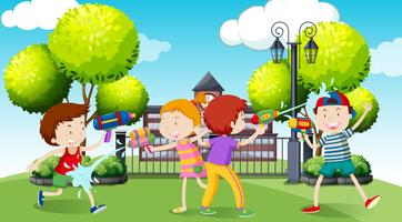 Children playing water gun in the park vector