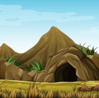 Scene with cave in the mountain vector