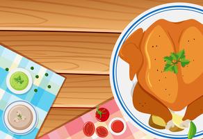 Roasted chicken on wooden board vector