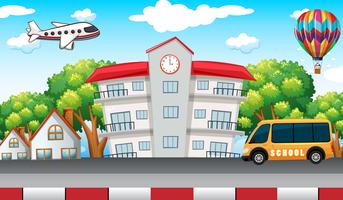 School building with school bus in front vector