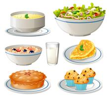 Different kind of food on plates vector