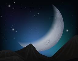 Cresent moon over hills scene