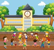Children playing soccer on field vector