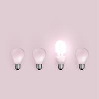 Energy saver lightbulb among old ones, vector illustration