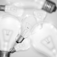 Realistic light bulbs with blurred ones, vector illustration