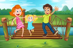Familia en el puente de madera en el parque vector
