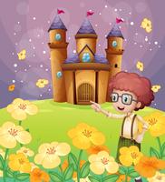 Un niño apuntando cerca de las flores en la colina con un castillo. vector