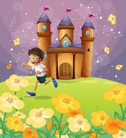 A boy playing in front of the castle vector