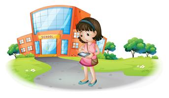A young girl texting in front of a school building vector