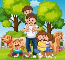 Familia con niños y mascotas en el parque. vector