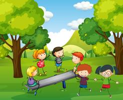 Happy children playing seesaw in park vector