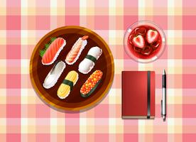 Una mesa con sushi, un cóctel, un bolígrafo y un cuaderno. vector
