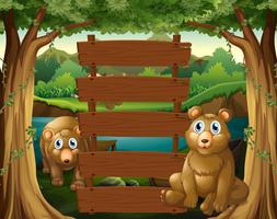 Wooden sign and bears in the woods