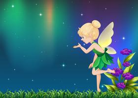 Cute fairy flying in garden at night vector