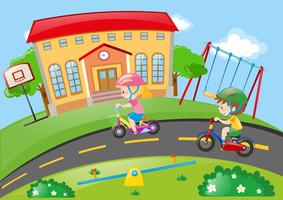 Boy and girl riding bike in the park vector