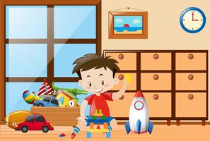 Boy playing toys in room vector