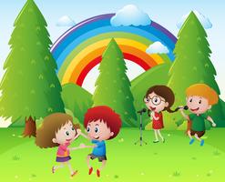 Children singing and dancing in park vector